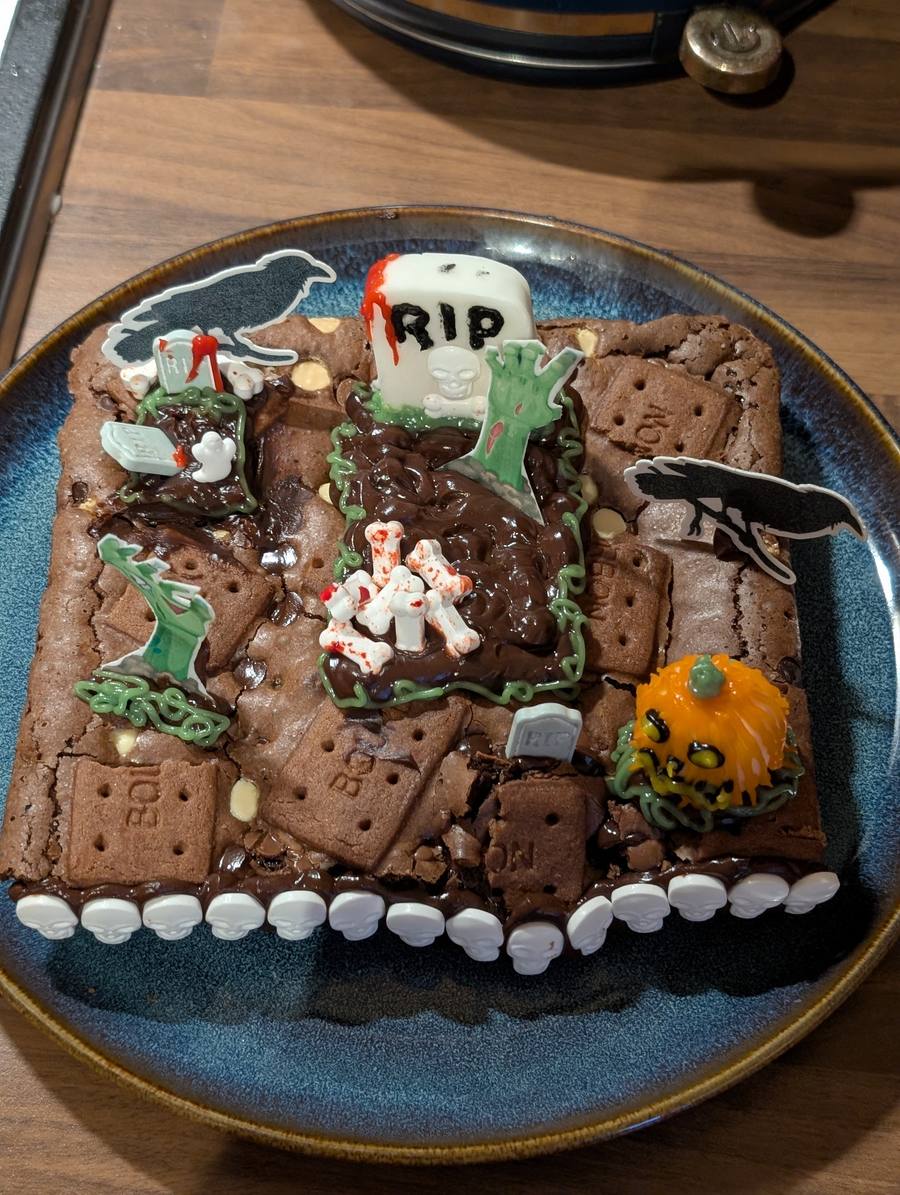 Halloween-themed brownie traybake with graveyard decorations
